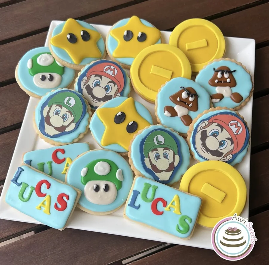 Colorful decorated cookies inspired by Mario, Luigi, stars, and coins